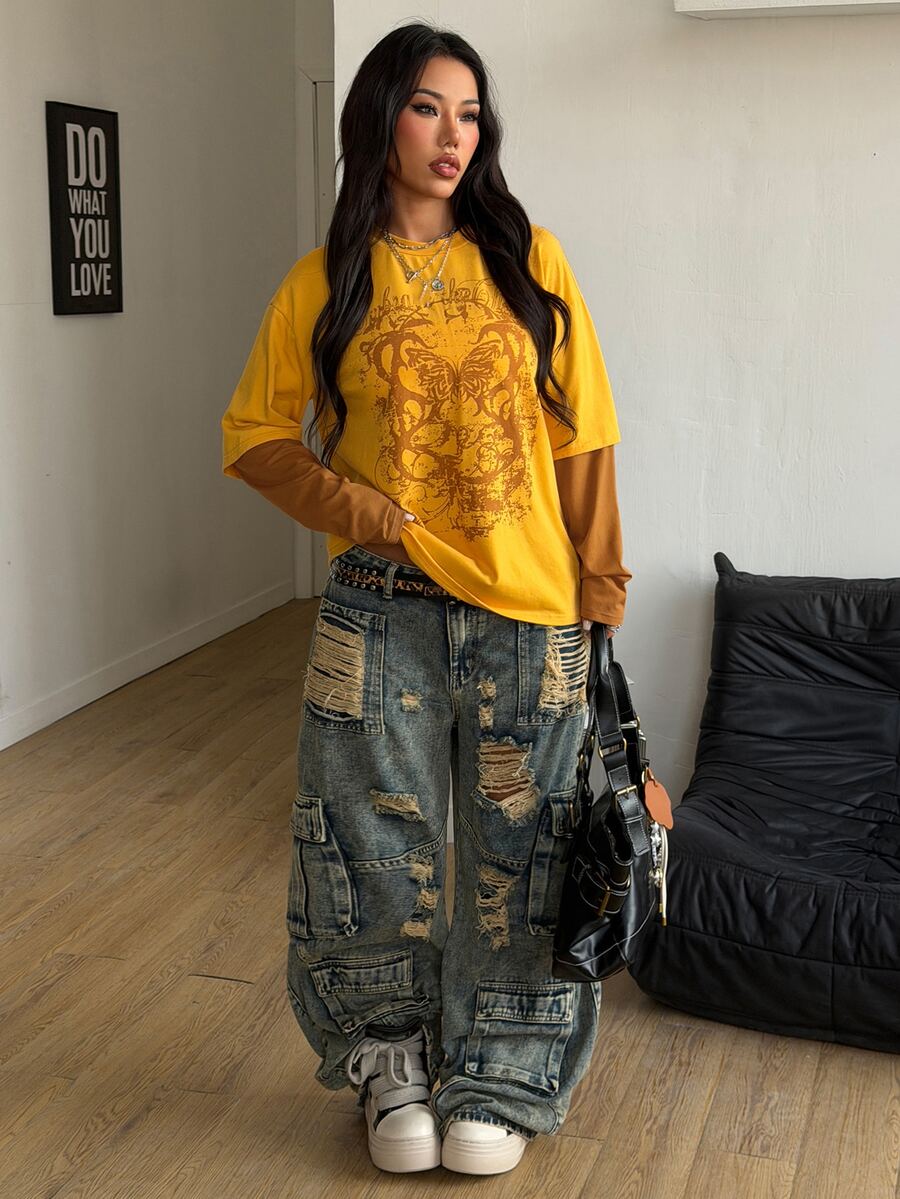 Women's casual graphic long sleeve t-shirt with a round neck, drop shoulder sleeves, and loose relaxed fit.