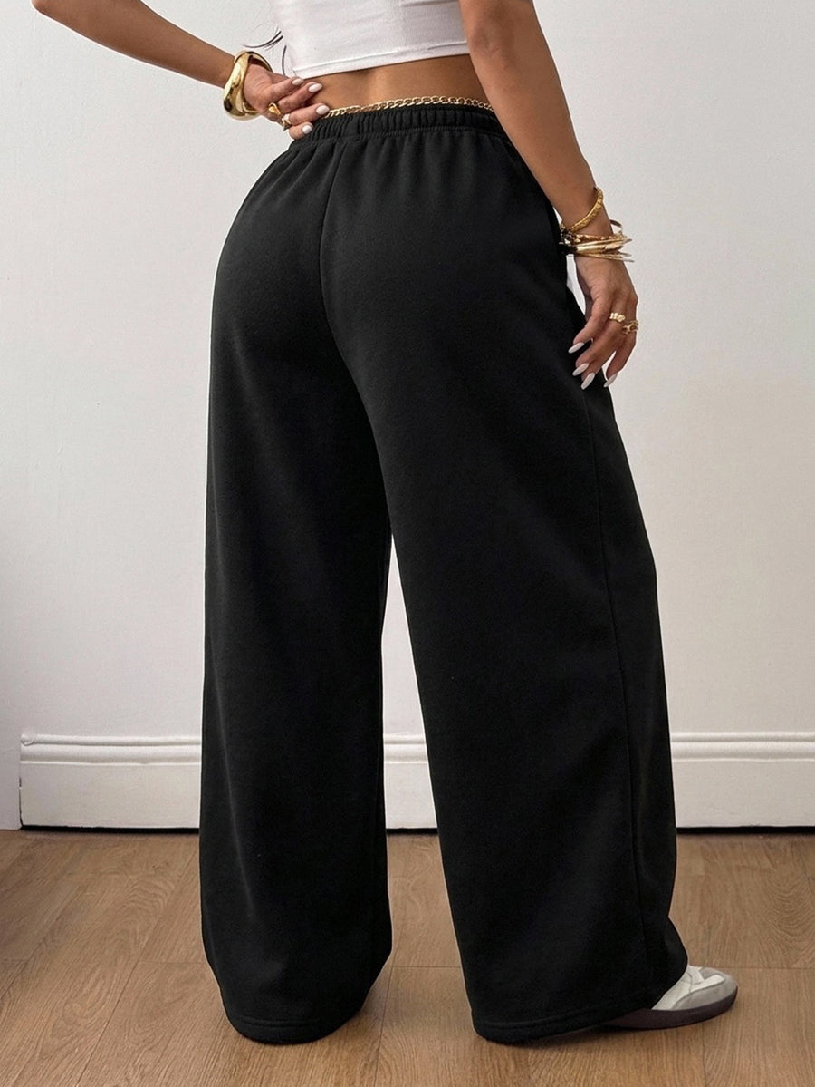 Women's loose wide leg casual sweatpants with an elastic waistband and side pockets