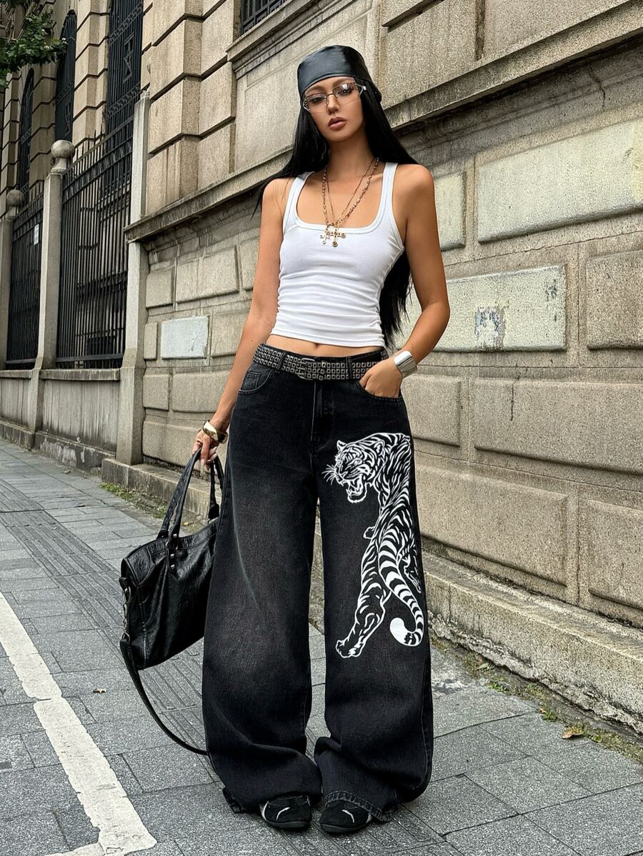 Front view of women's loose wide leg denim jeans featuring a mid waist, classic front pockets, and a zipper fly closure.