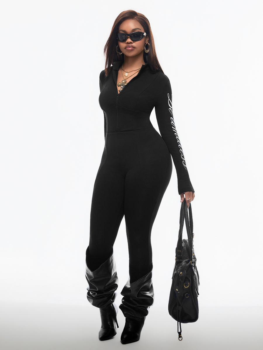 Fitted long sleeve unitard jumpsuit for women featuring a stand collar and front zipper closure in a solid color athletic style.