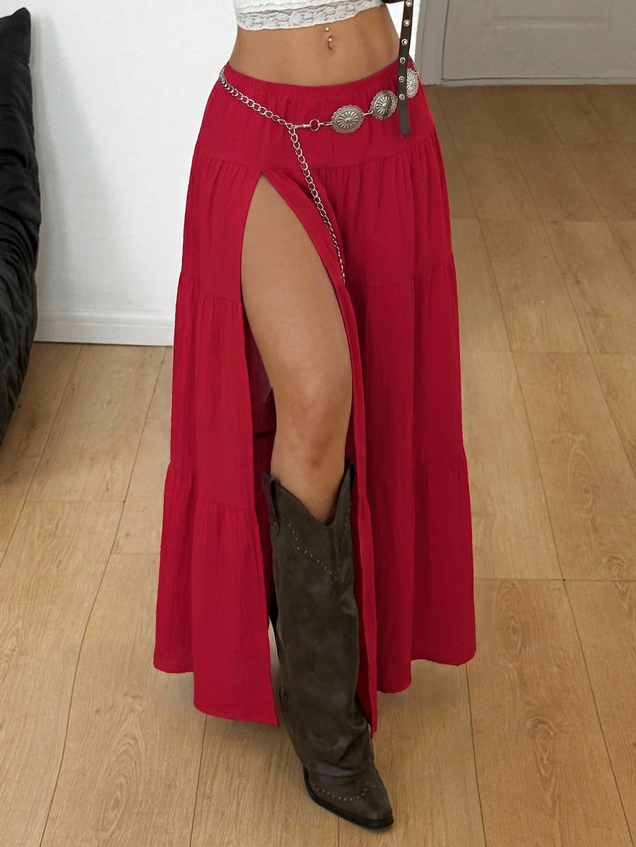 Women's red plaid long skirt featuring a low-rise waist and a side slit in lightweight woven fabric.