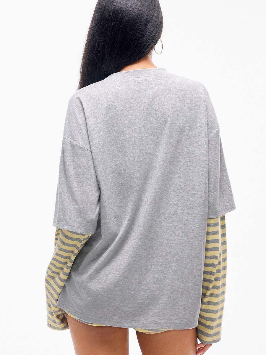 Women's casual graphic long sleeve t-shirt with a round neck, drop shoulder sleeves, and loose relaxed fit.