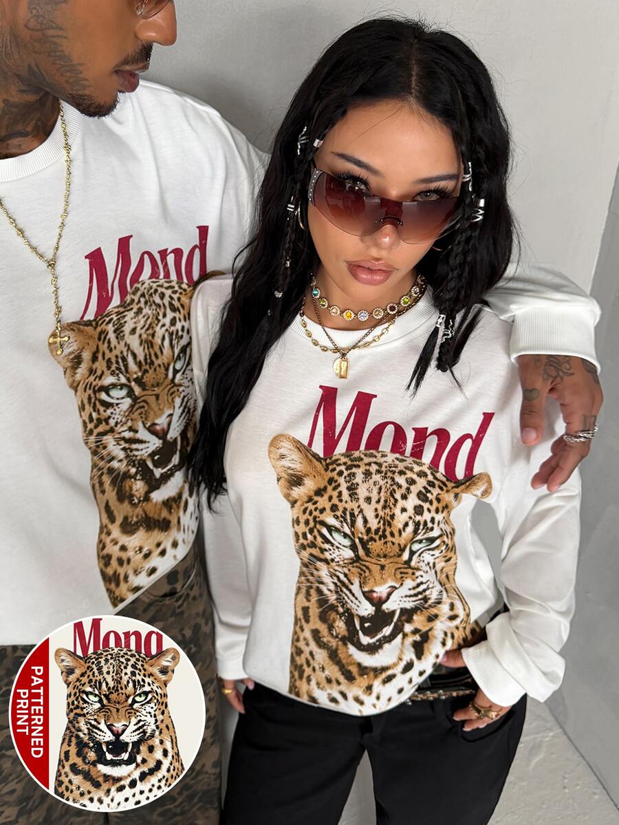 Women's white oversized long sleeve graphic T-shirt with drop shoulders and a round neckline.