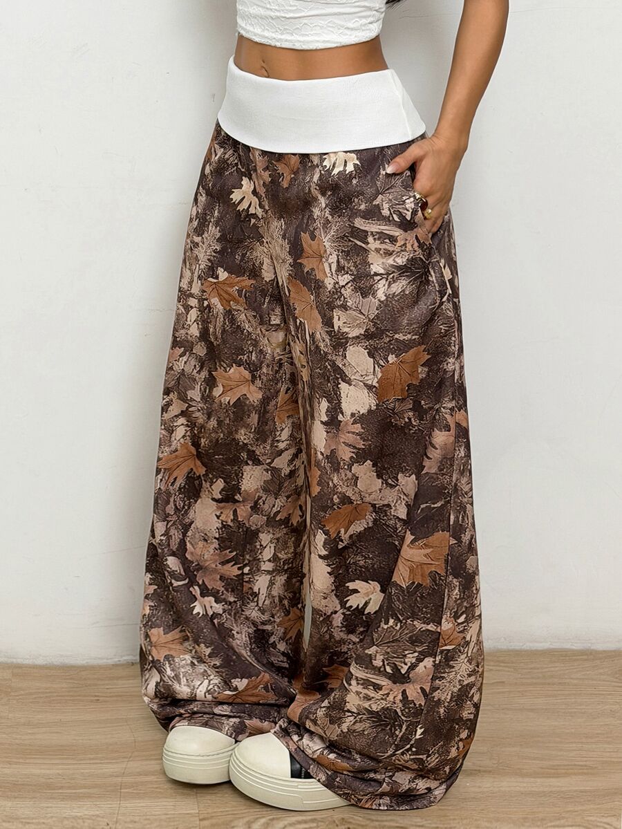 Women's wide leg trousers with a tree branch graphic pattern, loose fit, and mid-rise waist in woven fabric.