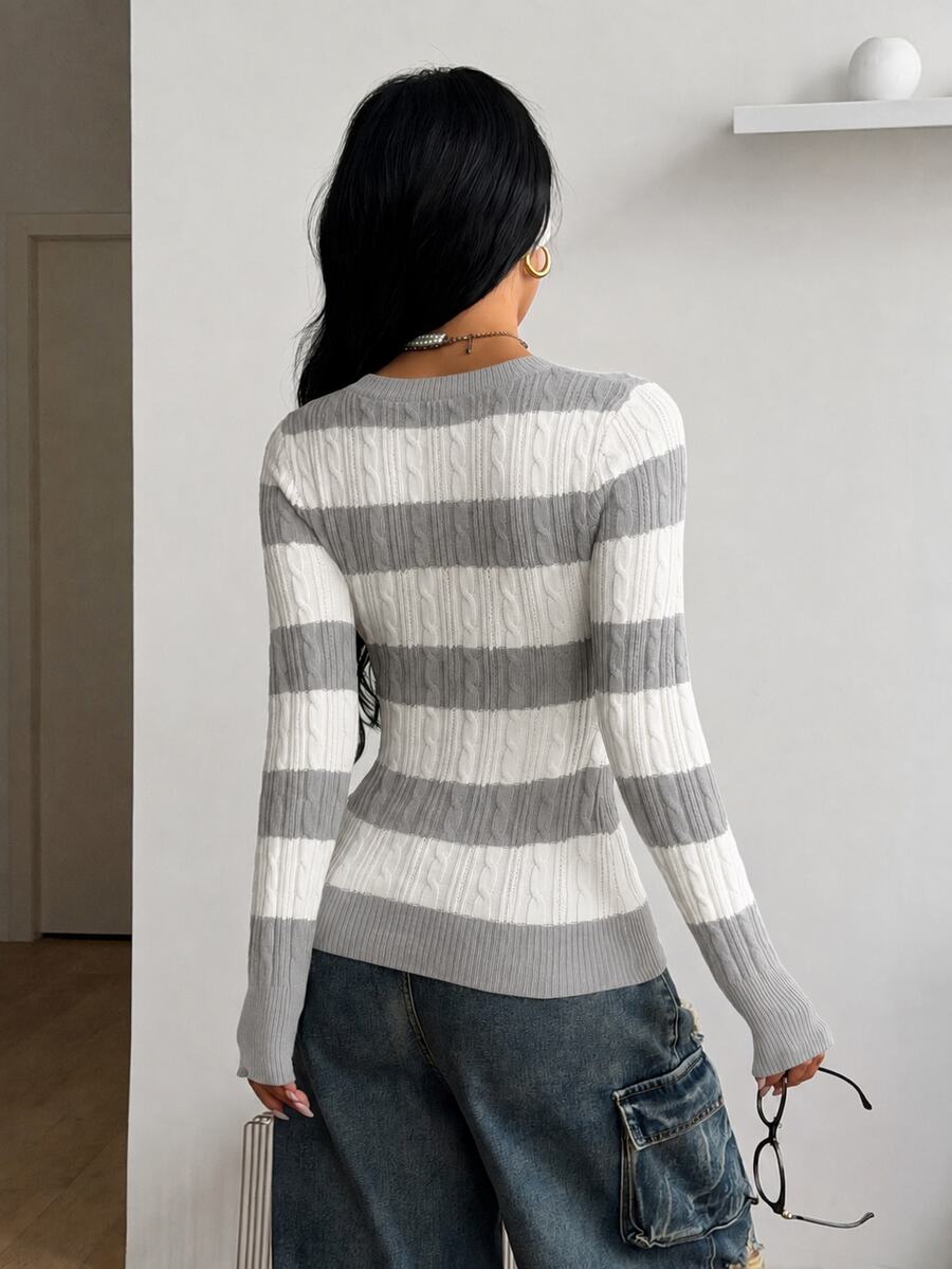 Women's slim fit cable-knit sweater with a V-neckline and long sleeves in solid green rib knit fabric.