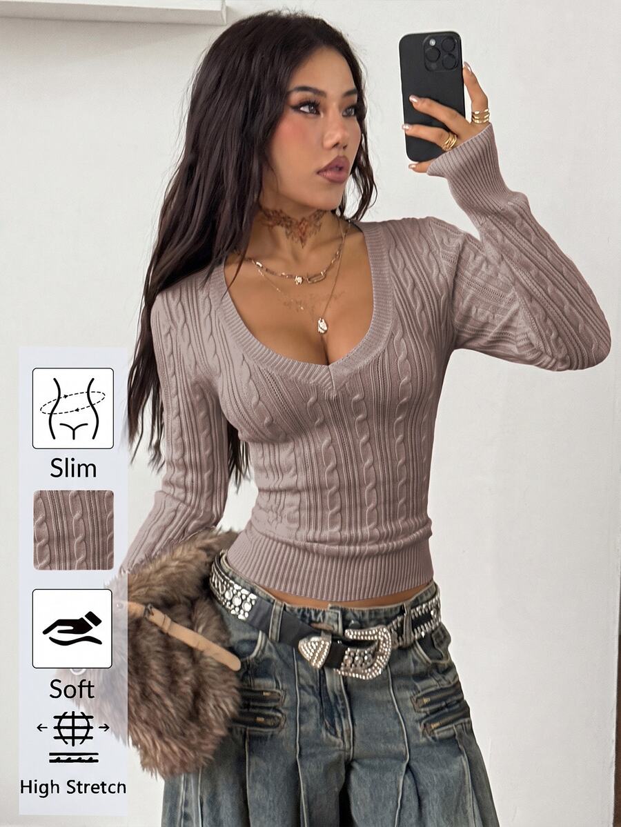 Women's slim fit cable-knit long sleeve sweater featuring a V-neckline and ribbed knit details.