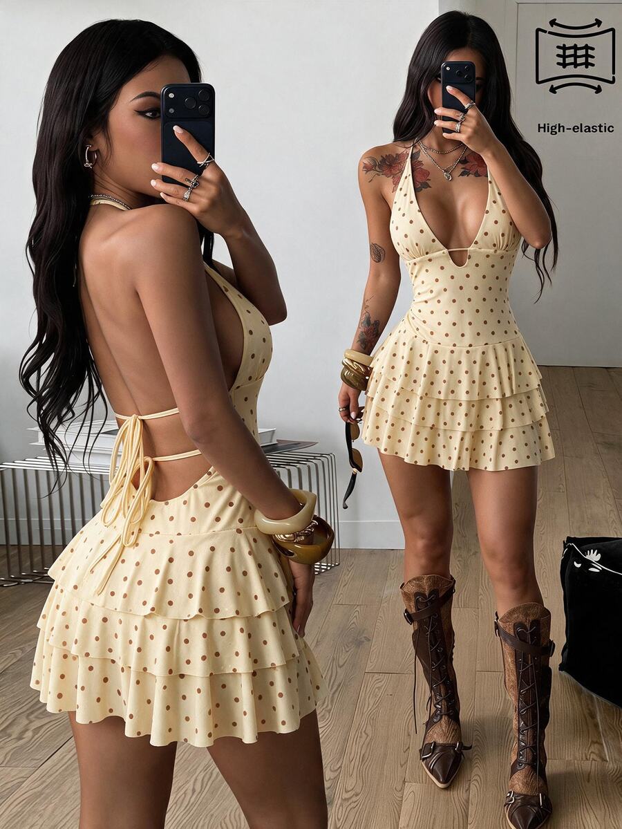 Front view of a women's lace halter mini dress featuring a slim-fit bodice, flared hem, and sleeveless design.