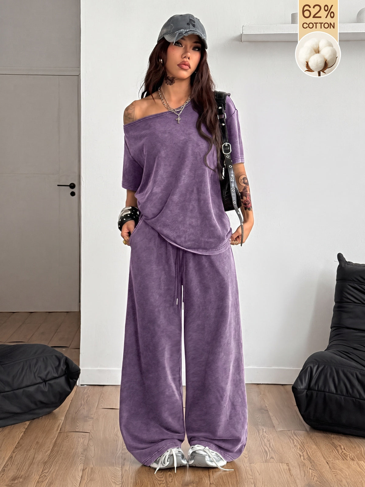 Women's two-piece outfit featuring an oversized asymmetrical neck t-shirt and matching wide-leg drawstring sweatpants.