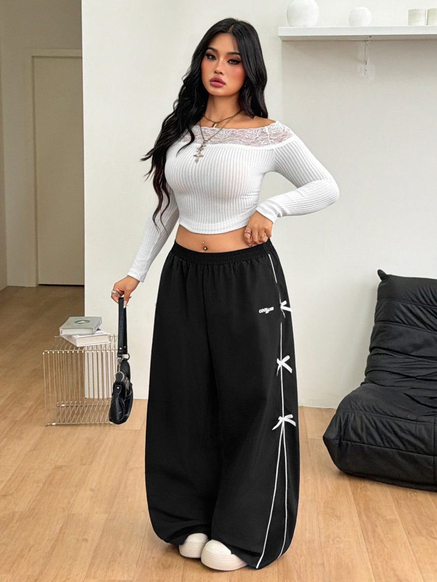 Plus size loose straight leg casual pants with elastic drawstring waist, contrast binding, and side pockets.