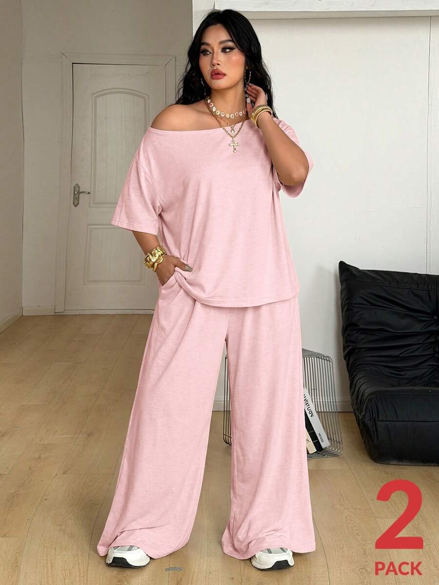 Women's two-piece lounge set featuring a loose drop shoulder asymmetrical neck short sleeve t-shirt and wide-leg knit pants with pockets.