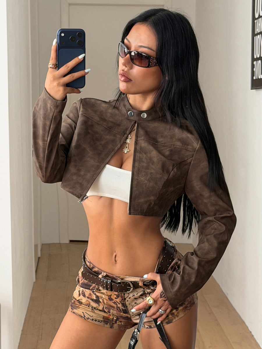 Front view of a women's black cropped PU leather jacket featuring a stand collar, long sleeves, and front zipper closure.