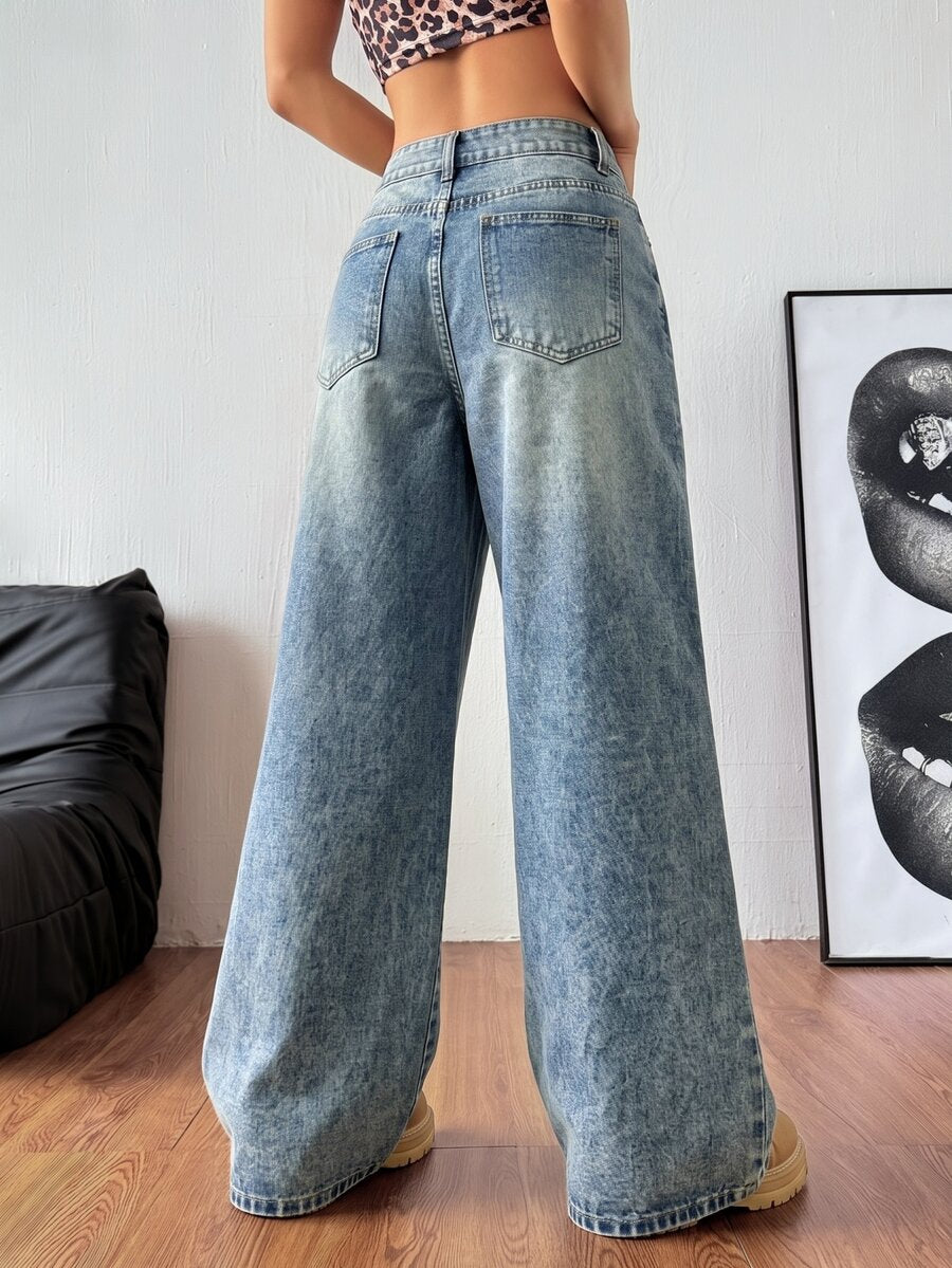 Women's relaxed fit wide leg denim jeans with pockets and a zipper fly.