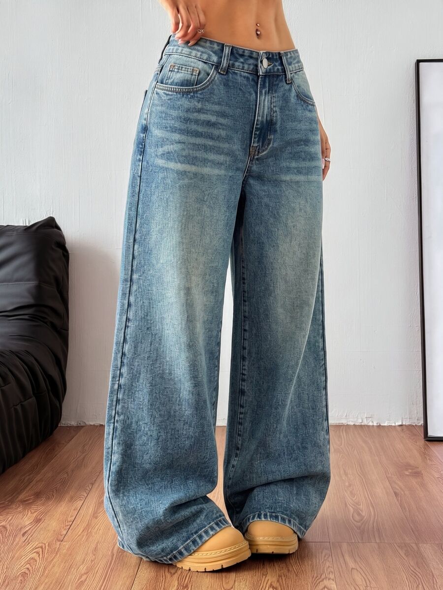 Women's relaxed fit wide leg denim jeans with pockets and a zipper fly.