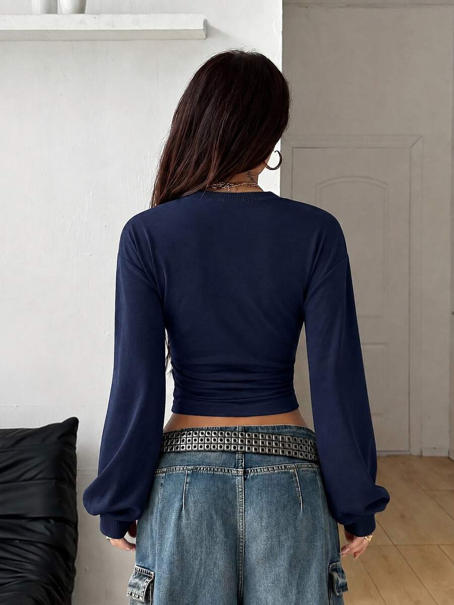 Women's brown waist-cinching sweatshirt featuring a round neck, drop shoulder long sleeves, and rib-knit cuffs.