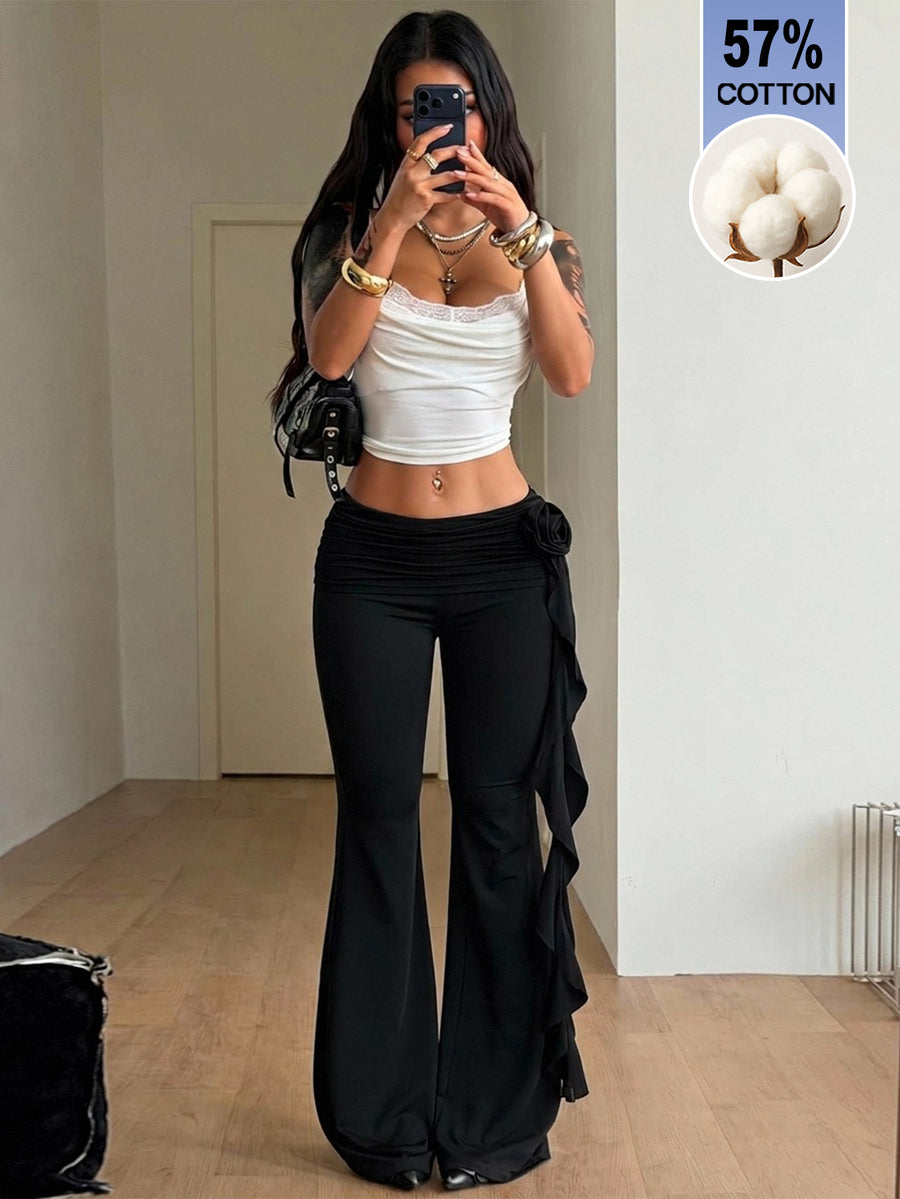 Black low waist flare pants featuring 3D rose and side stripe detailing in stretchy mesh fabric.