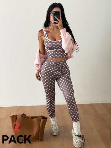 Women's two-piece activewear set featuring a multicolor polka dot backless crop top and matching slim-fit leggings.