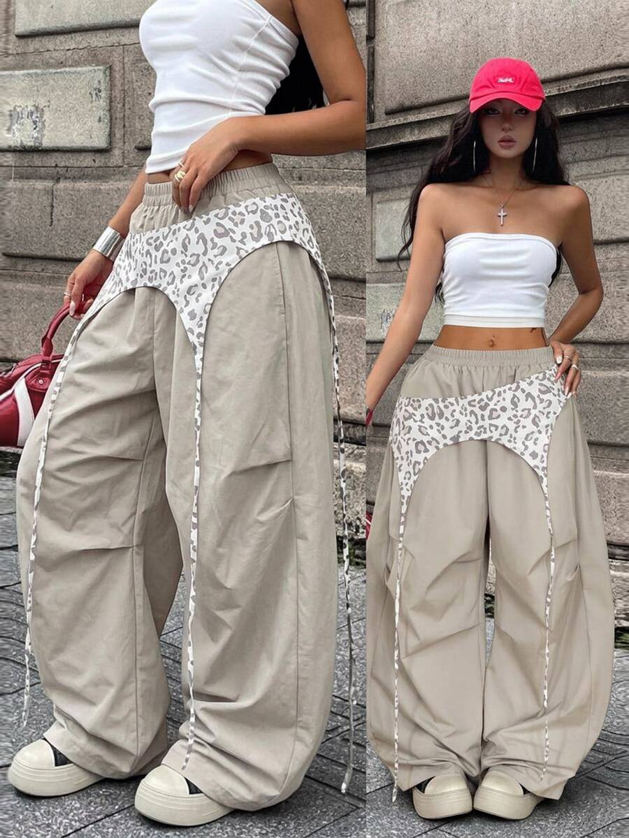 Women's casual wide leg long pants featuring an elastic drawstring waistband and loose fit silhouette.