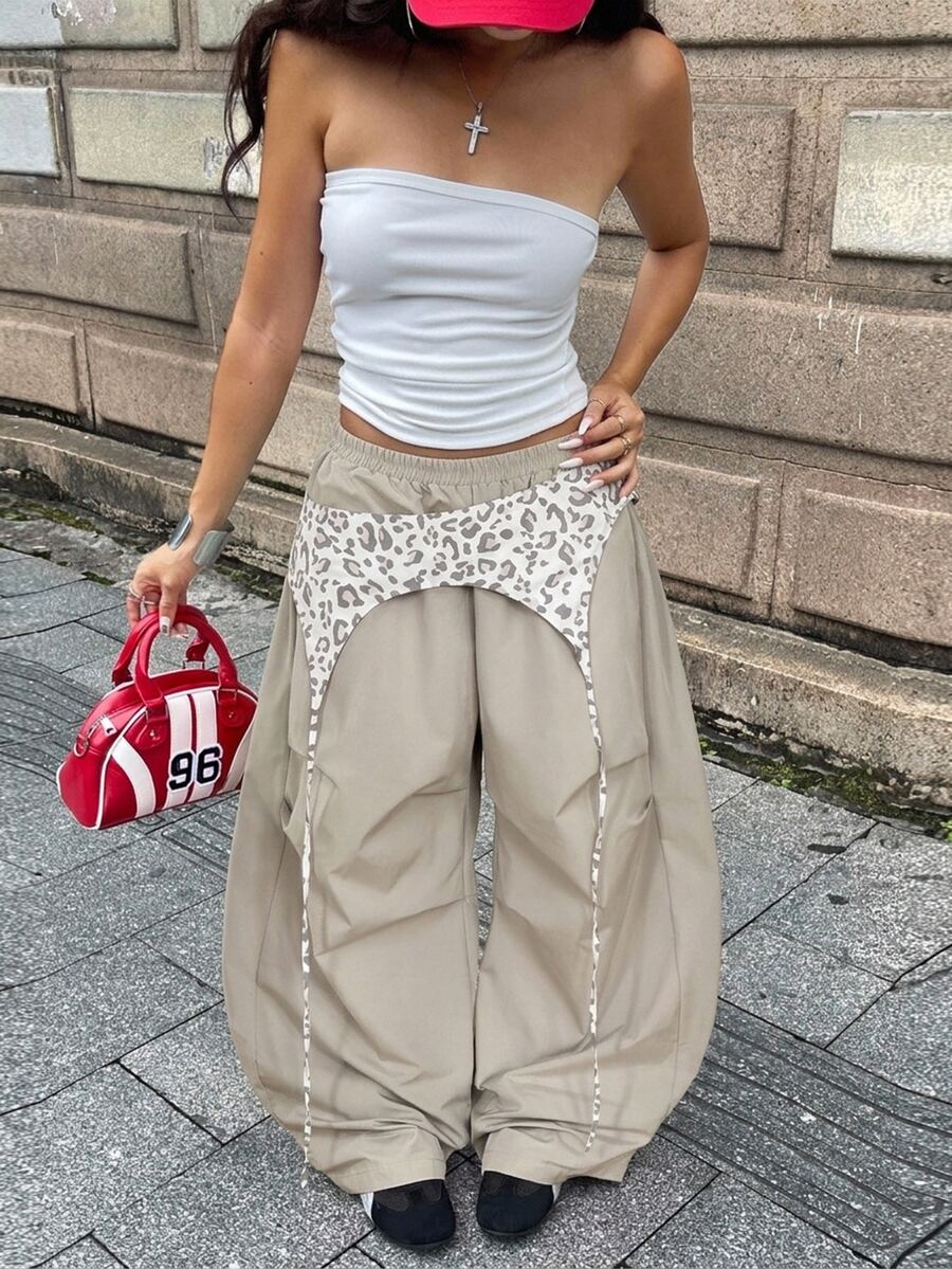Women's casual wide leg long pants featuring an elastic drawstring waistband and loose fit silhouette.
