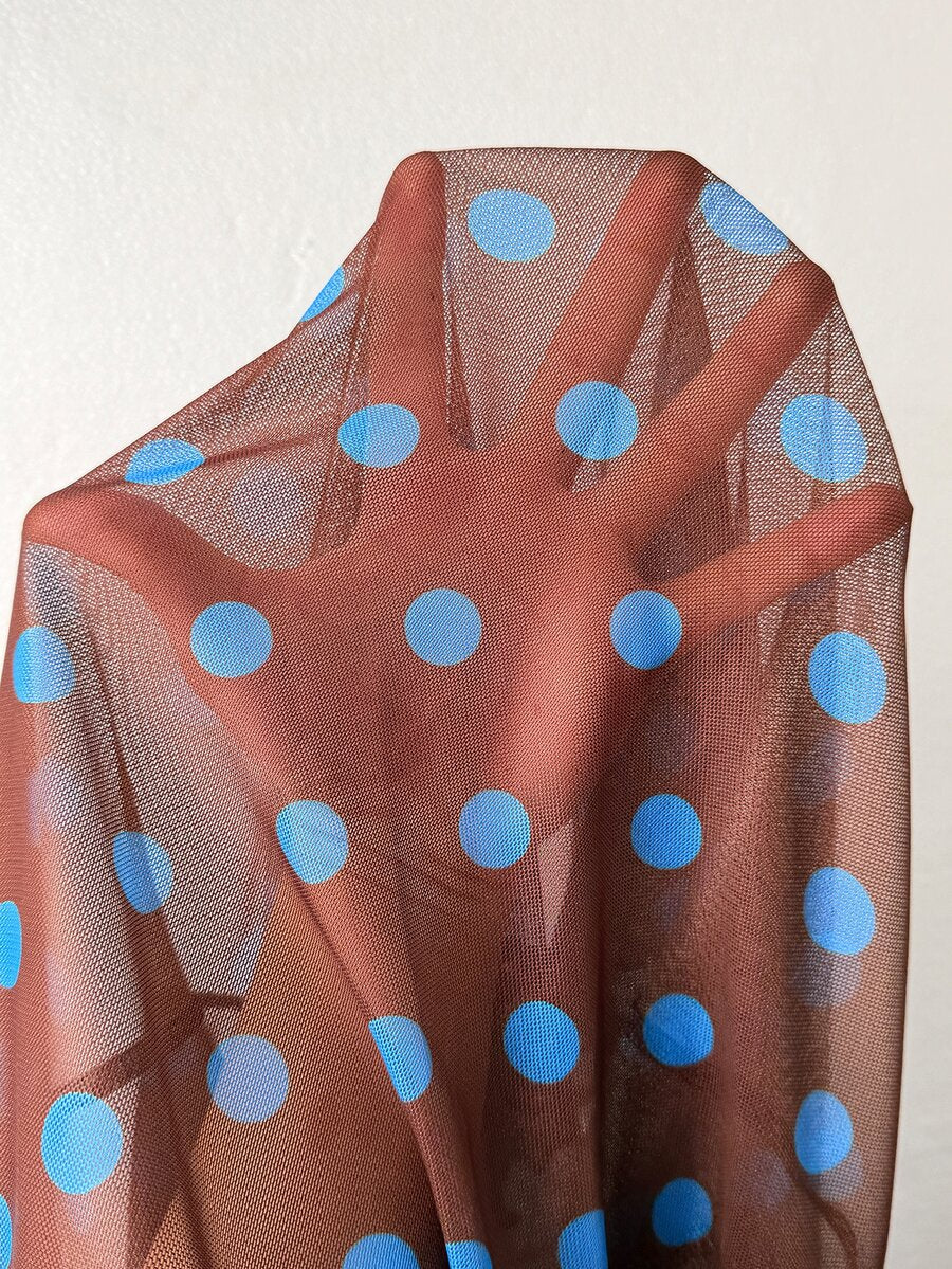 Women's brown sheer mesh long sleeve top featuring a polka dot print, stand collar, and lettuce trim details.