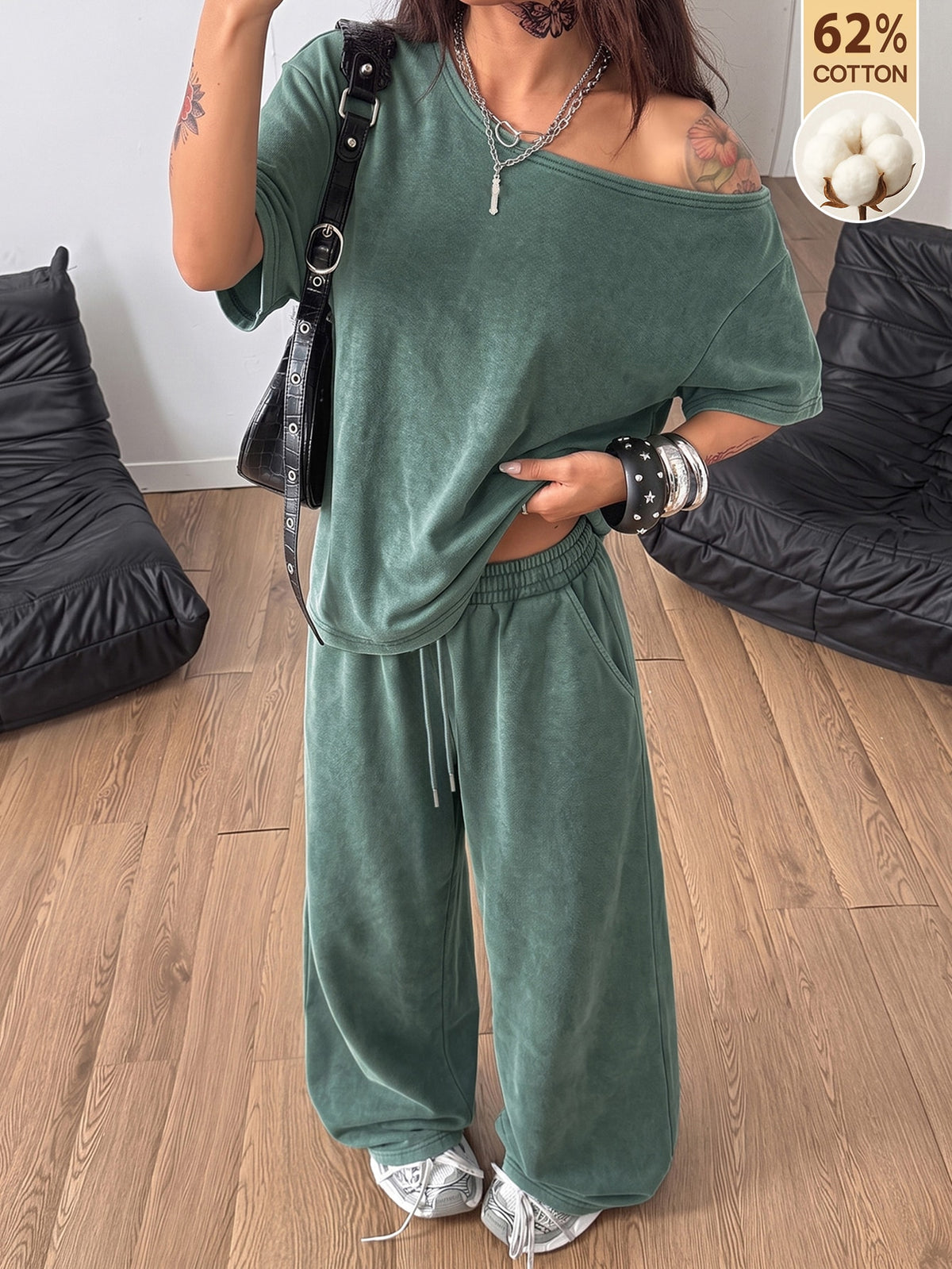 Women's two-piece outfit featuring an oversized asymmetrical neck t-shirt and matching wide-leg drawstring sweatpants.