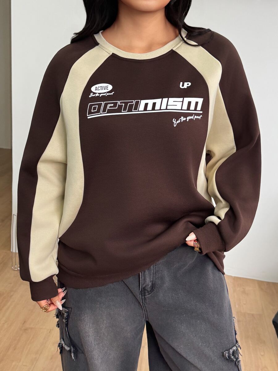 Color-blocked loose pullover sweatshirt with a round neckline, raglan sleeves, and ribbed knit trim.
