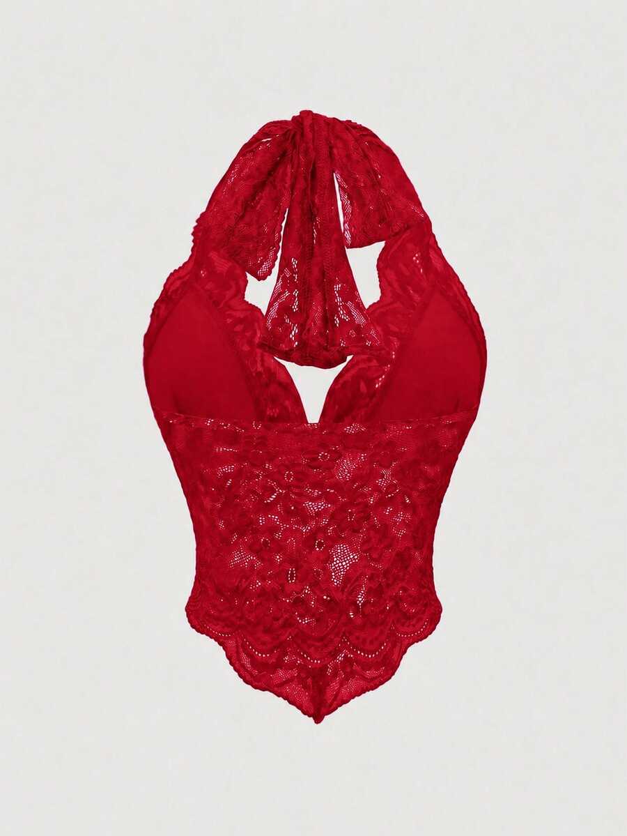 Women's lace halter neck crop top with backless tie closure, scallop trim, and asymmetrical hem.