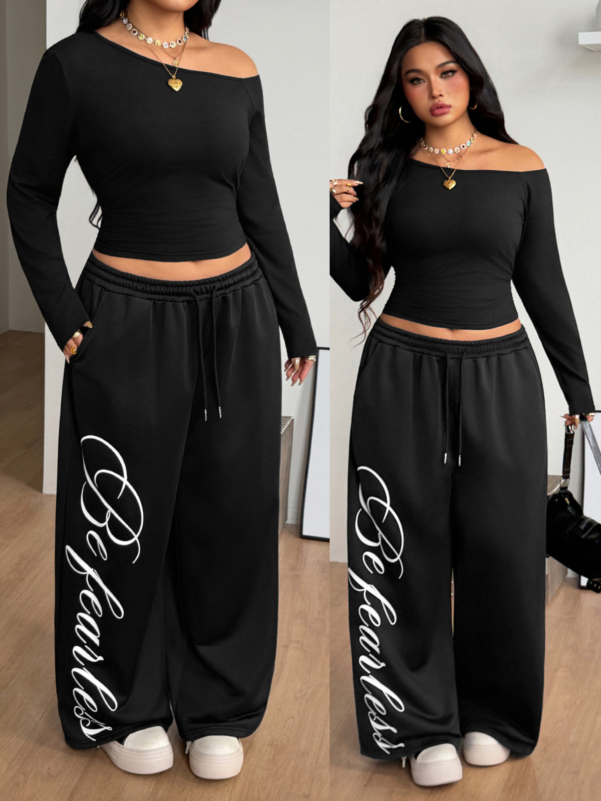 Women's two-piece outfit featuring a black and grey striped long-sleeve crop top with an asymmetrical neckline and coordinating wide-leg sweatpants.