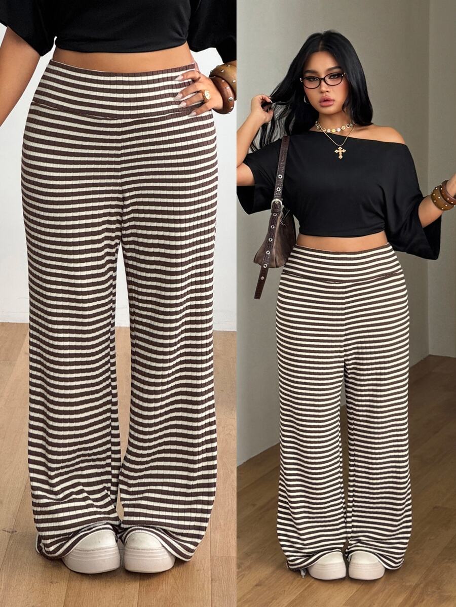 Women's casual straight leg sweatpants featuring a black and white polka dot design with an elastic waistband.