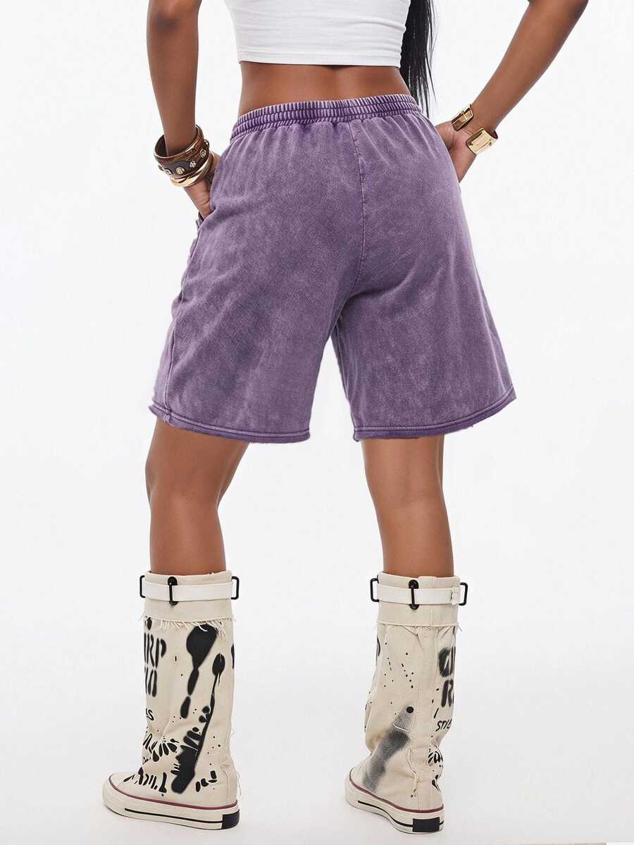 Women's loose fit dark grey track Bermuda shorts featuring an elastic drawstring waistband and side slit hem.