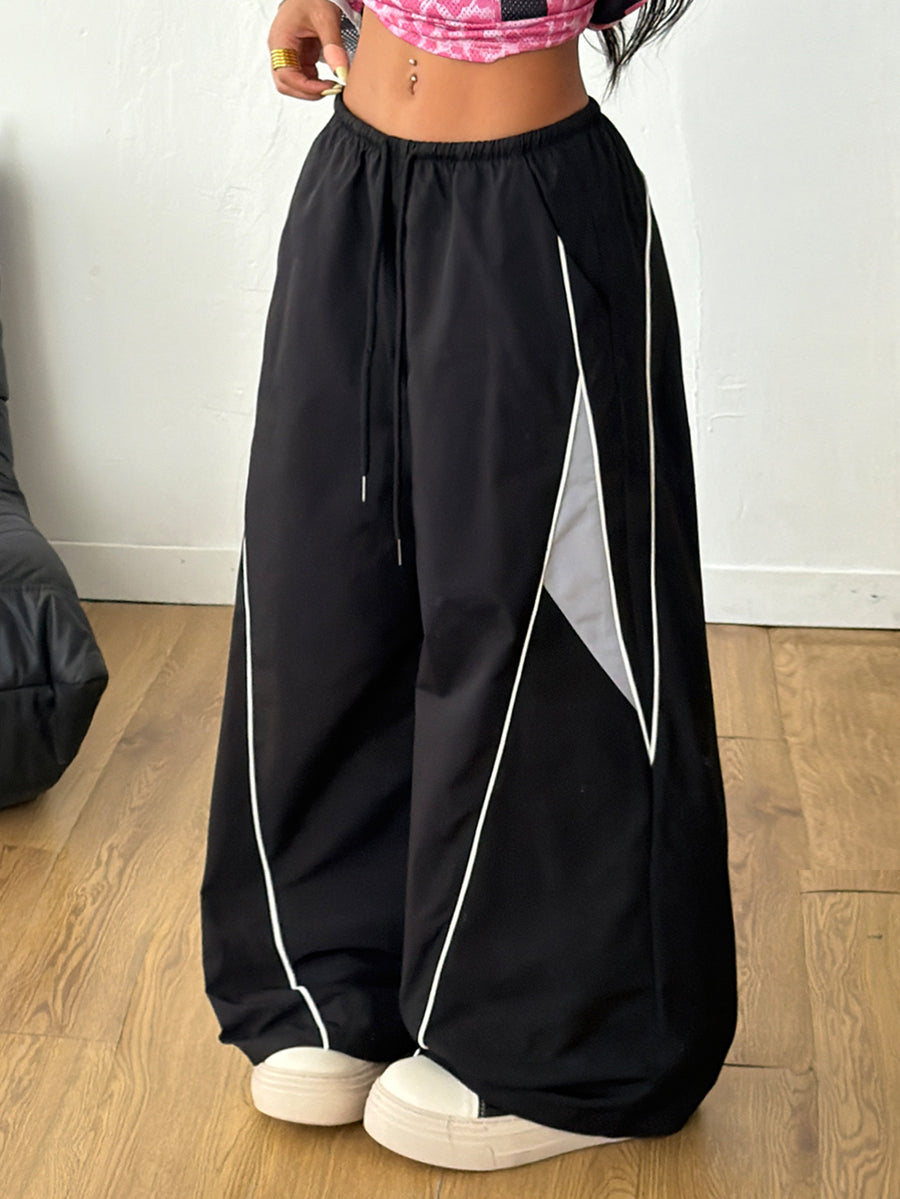 Plus size loose straight leg casual pants with elastic drawstring waist, contrast binding, and side pockets.