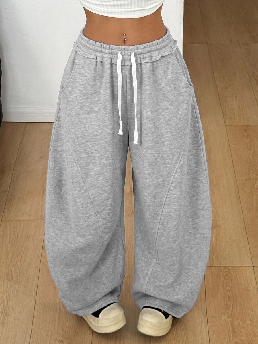 Women's casual grey plaid sweatpants featuring an elastic drawstring waistband, side pockets, and a relaxed loose fit.