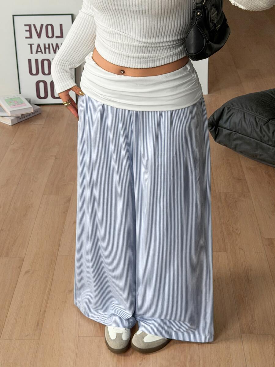 Women's plus size wide leg cotton pants featuring a relaxed loose fit and high waist design.