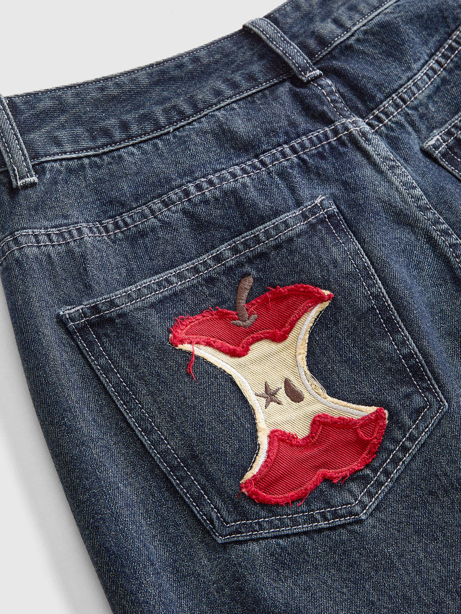 Women's loose baggy blue denim jeans featuring embroidered dragonfly and ladybug patch appliques, front pockets, and a straight-leg cut.