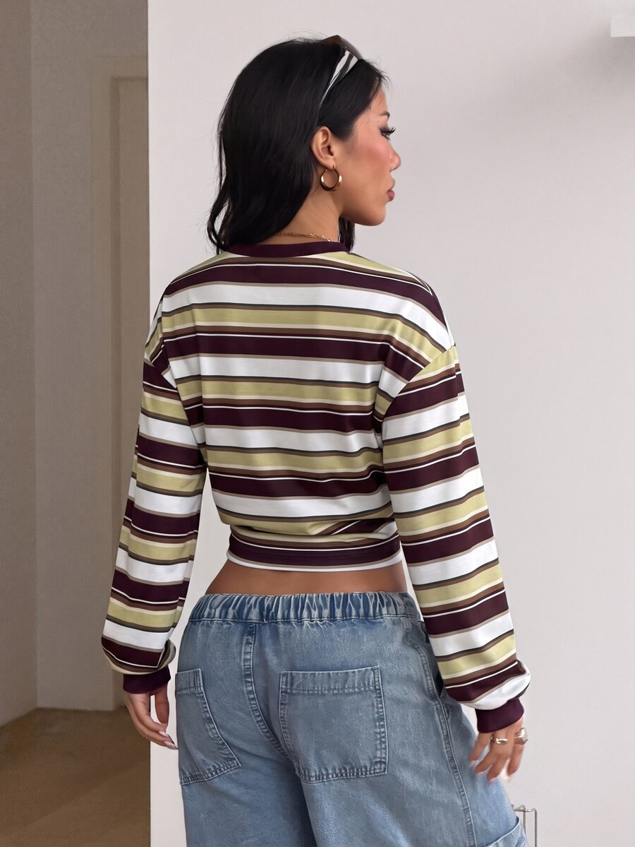 Women's striped pullover sweatshirt featuring drop shoulder long sleeves and a classic round neckline.