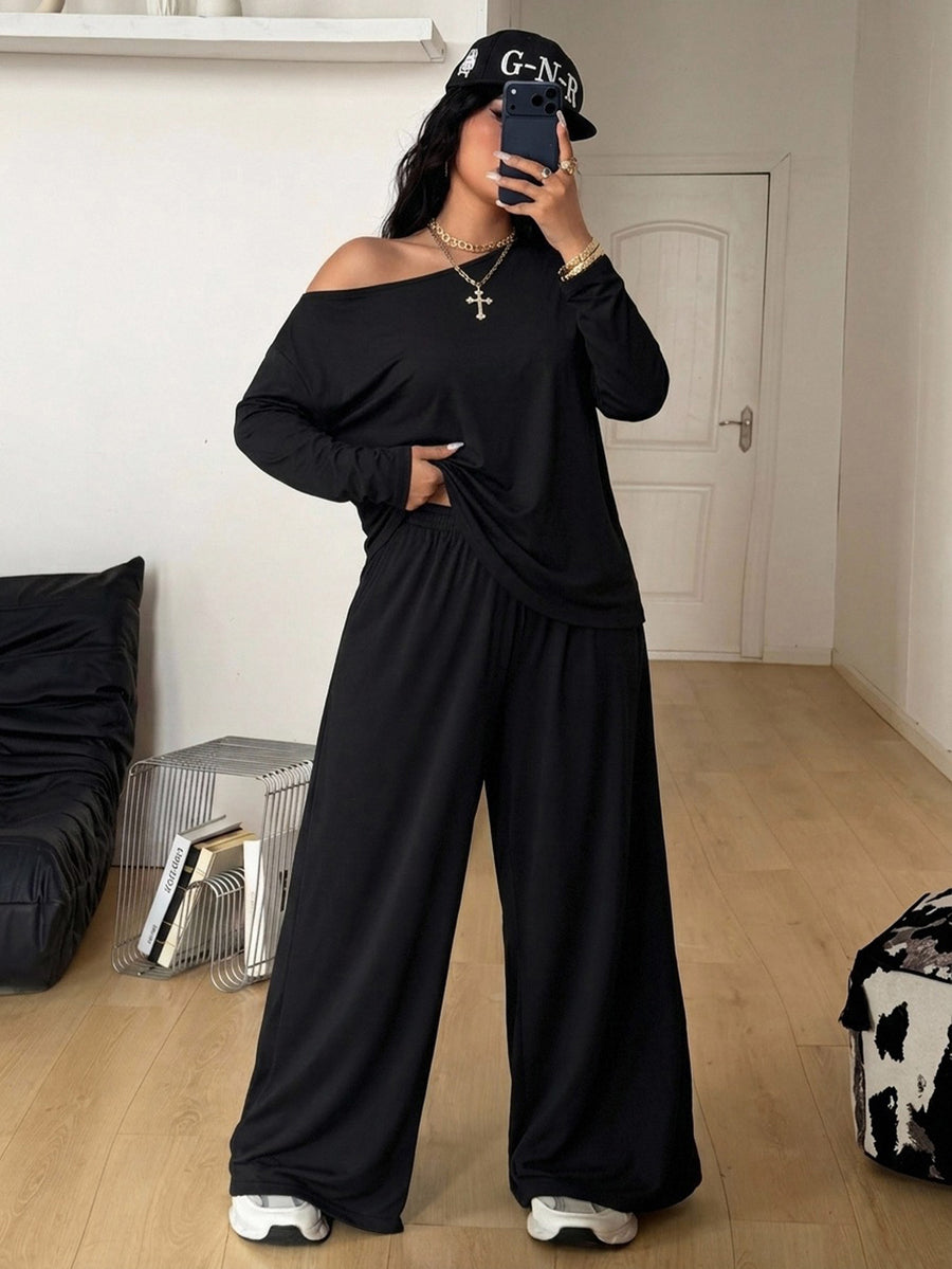 Women's two-piece lounge set featuring a loose drop shoulder asymmetrical neck short sleeve t-shirt and wide-leg knit pants with pockets.