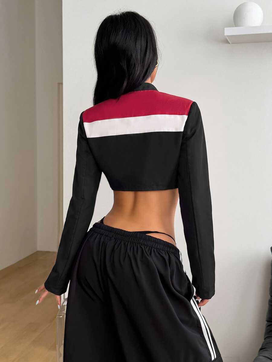 Front view of a women's black cropped PU leather jacket featuring a stand collar, long sleeves, and front zipper closure.
