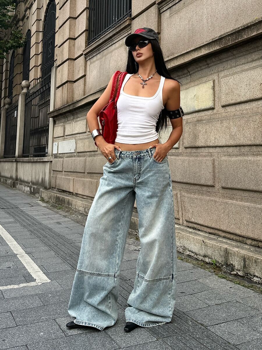Women's loose wide-leg jeans in light wash denim with low waist and extra-long relaxed fit