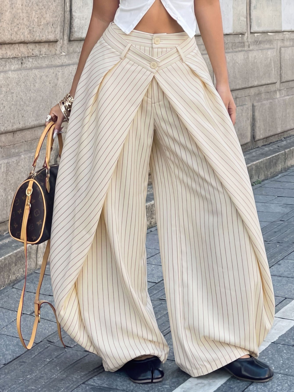 Women's loose fit pleated wide leg pants in royal blue pinstripe woven fabric with zipper fly closure.
