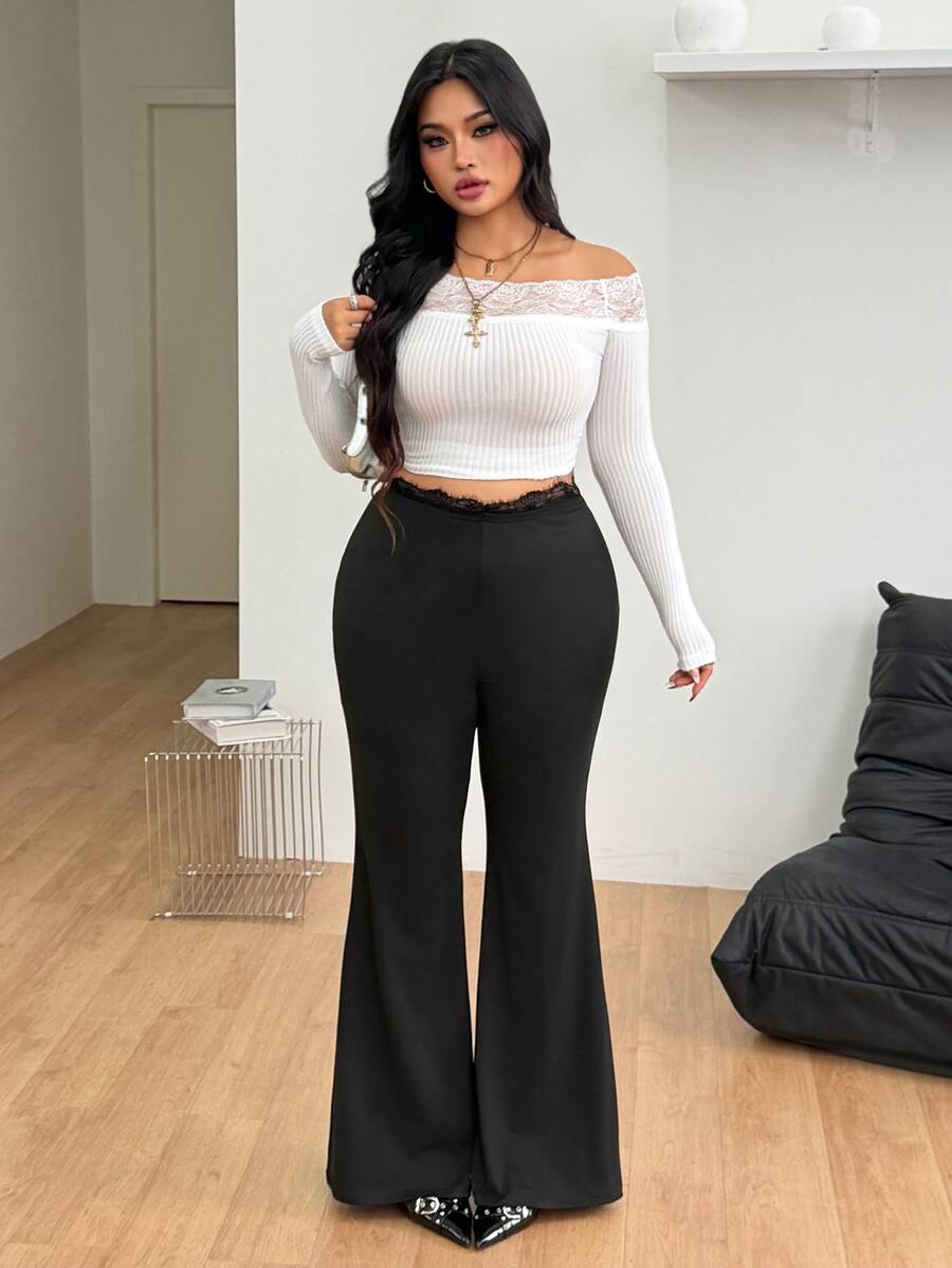 Women's plus size black flare leg pants with high elastic waist in stretchy knit fabric