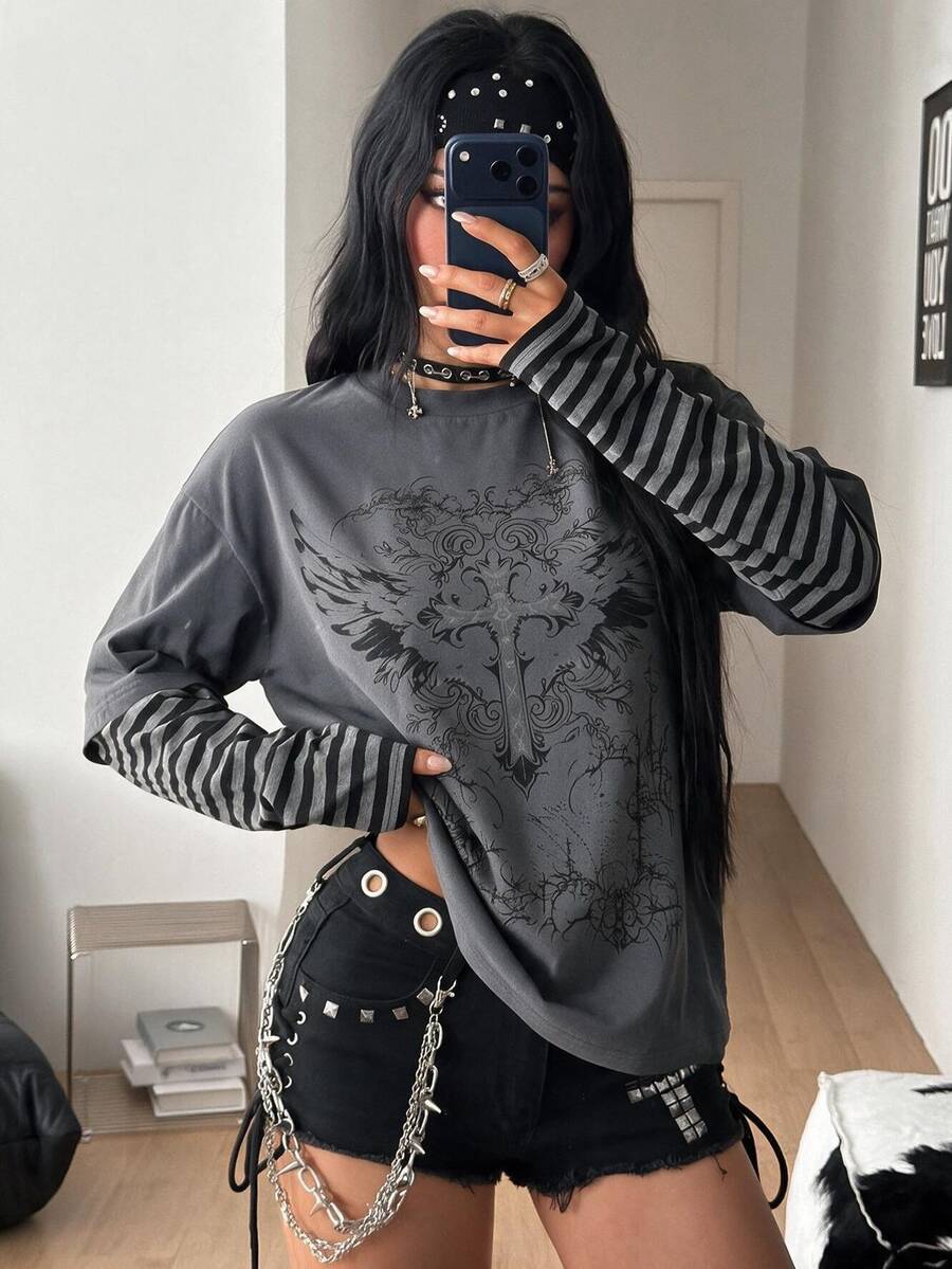 Women's casual graphic long sleeve t-shirt with a round neck, drop shoulder sleeves, and loose relaxed fit.