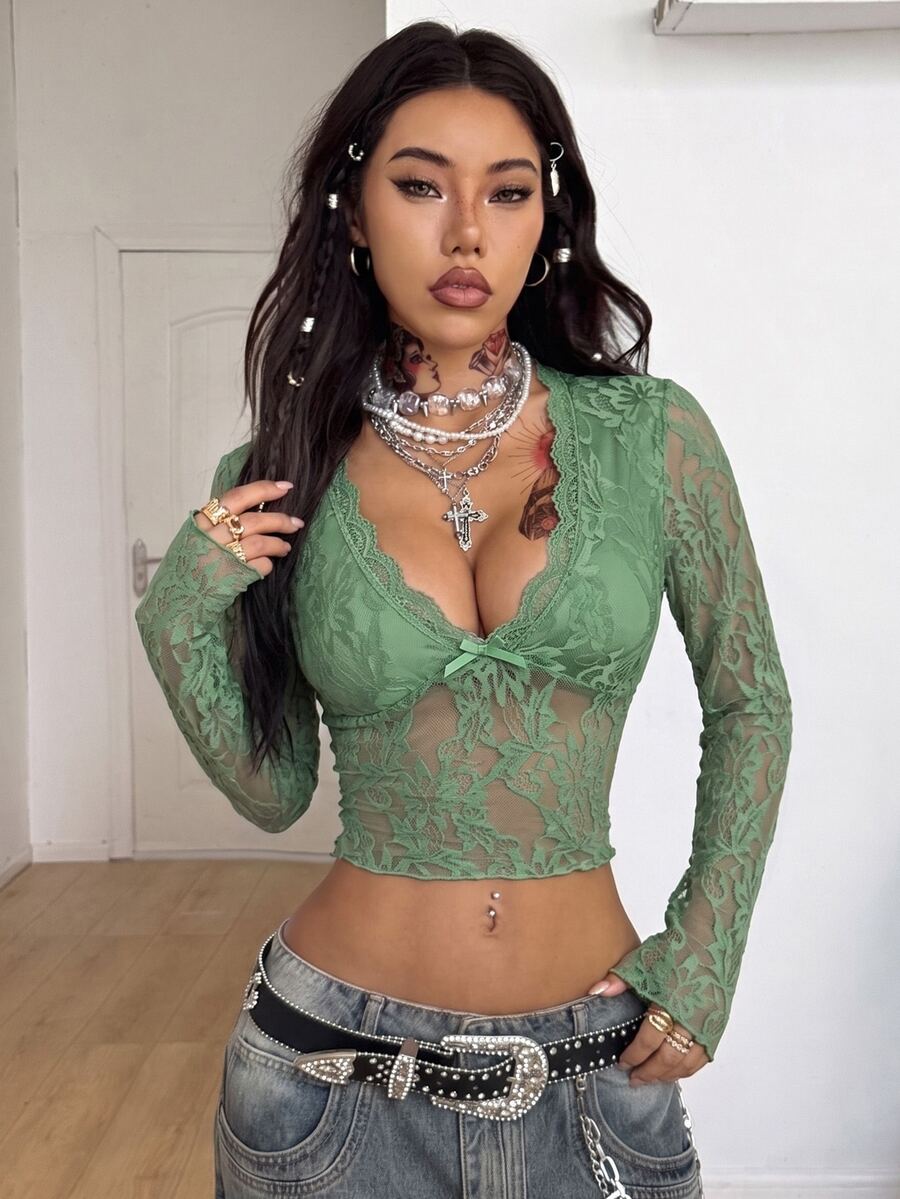 Women's polka dot sheer mesh crop blouse featuring contrast scallop lace trim along the V-neckline and long sleeves in a slim fit silhouette.