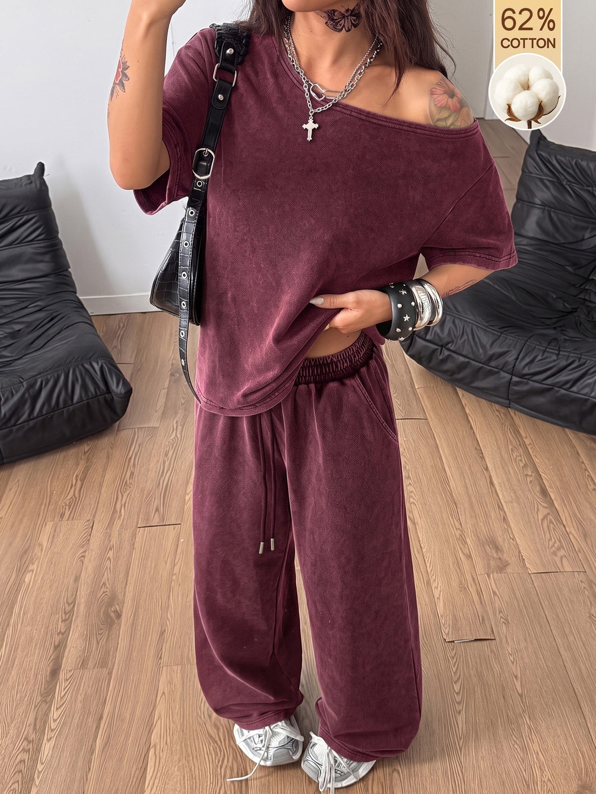 Women's two-piece outfit featuring an oversized asymmetrical neck t-shirt and matching wide-leg drawstring sweatpants.