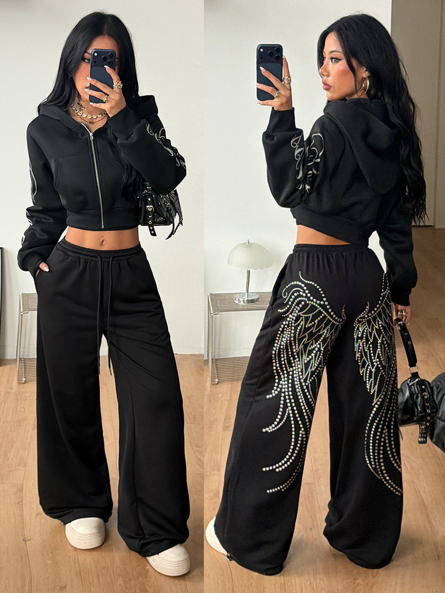 Women's loose fit wide leg graphic sweatpants in light grey with an elastic drawstring waistband