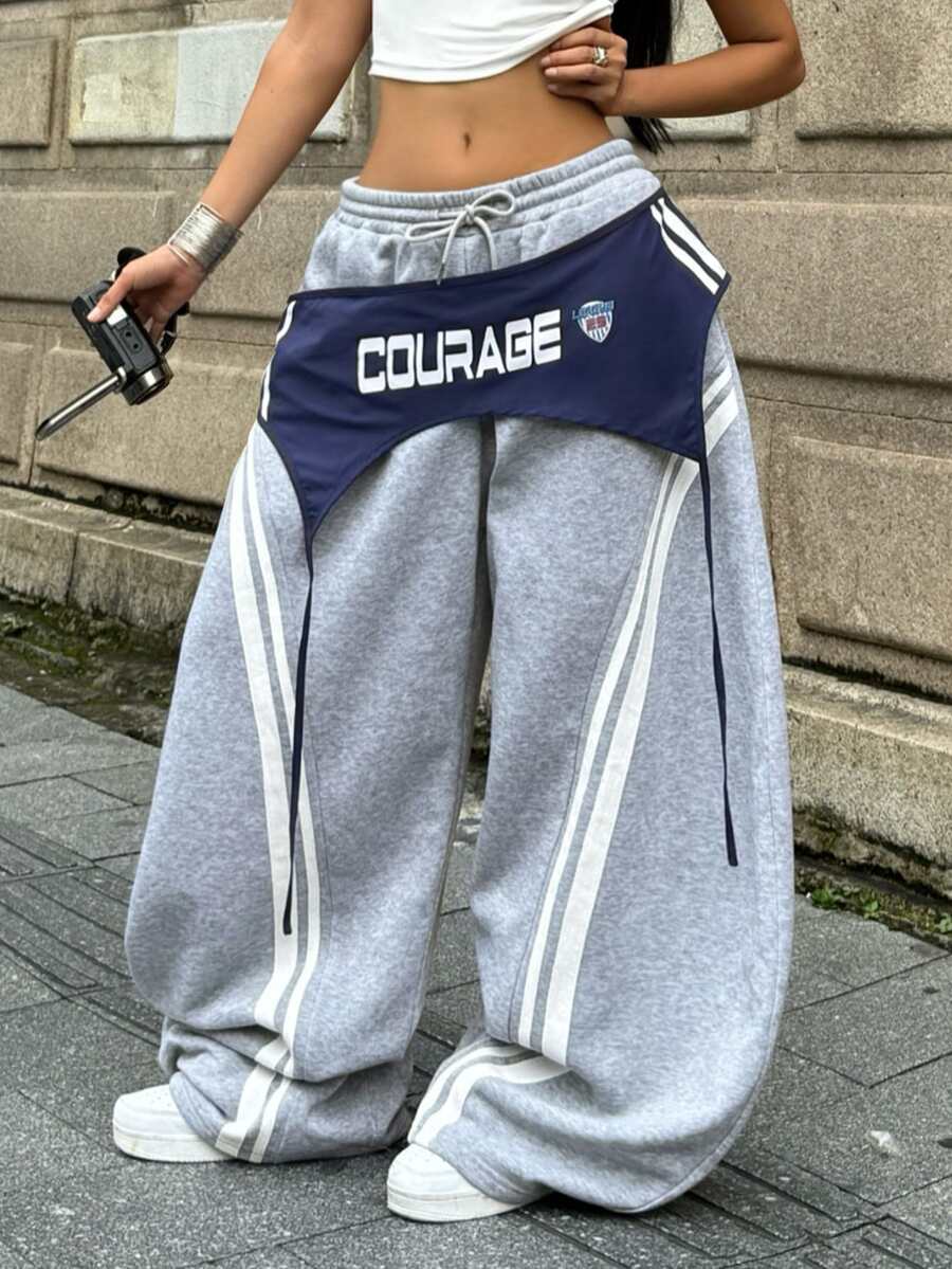 Women's casual grey plaid sweatpants featuring an elastic drawstring waistband, side pockets, and a relaxed loose fit.