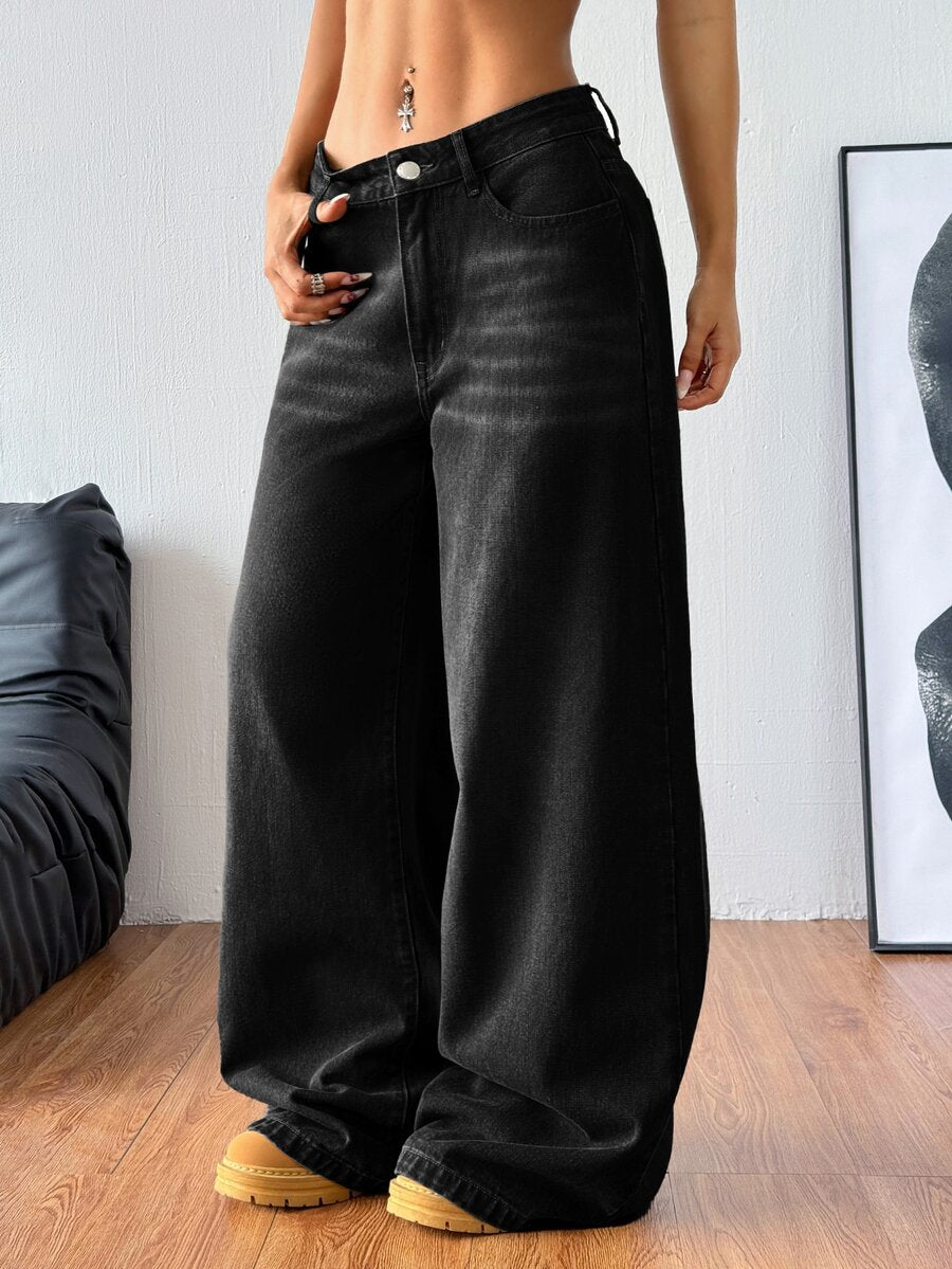 Women's relaxed fit wide leg denim jeans with pockets and a zipper fly.