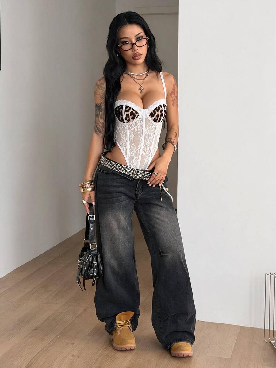 Fitted women's lace and mesh cami bodysuit with spaghetti straps.