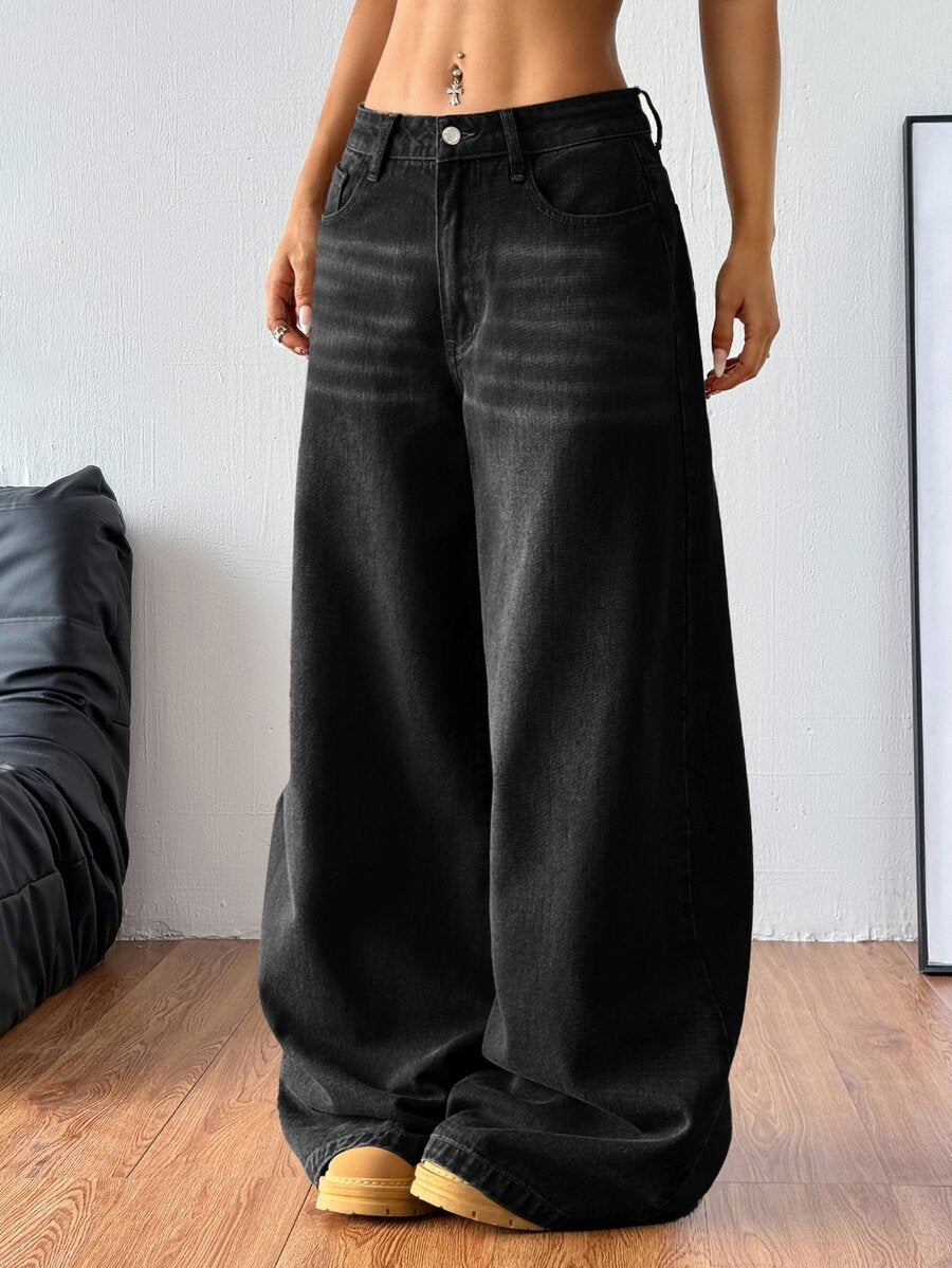 Women's relaxed fit wide leg denim jeans with pockets and a zipper fly.