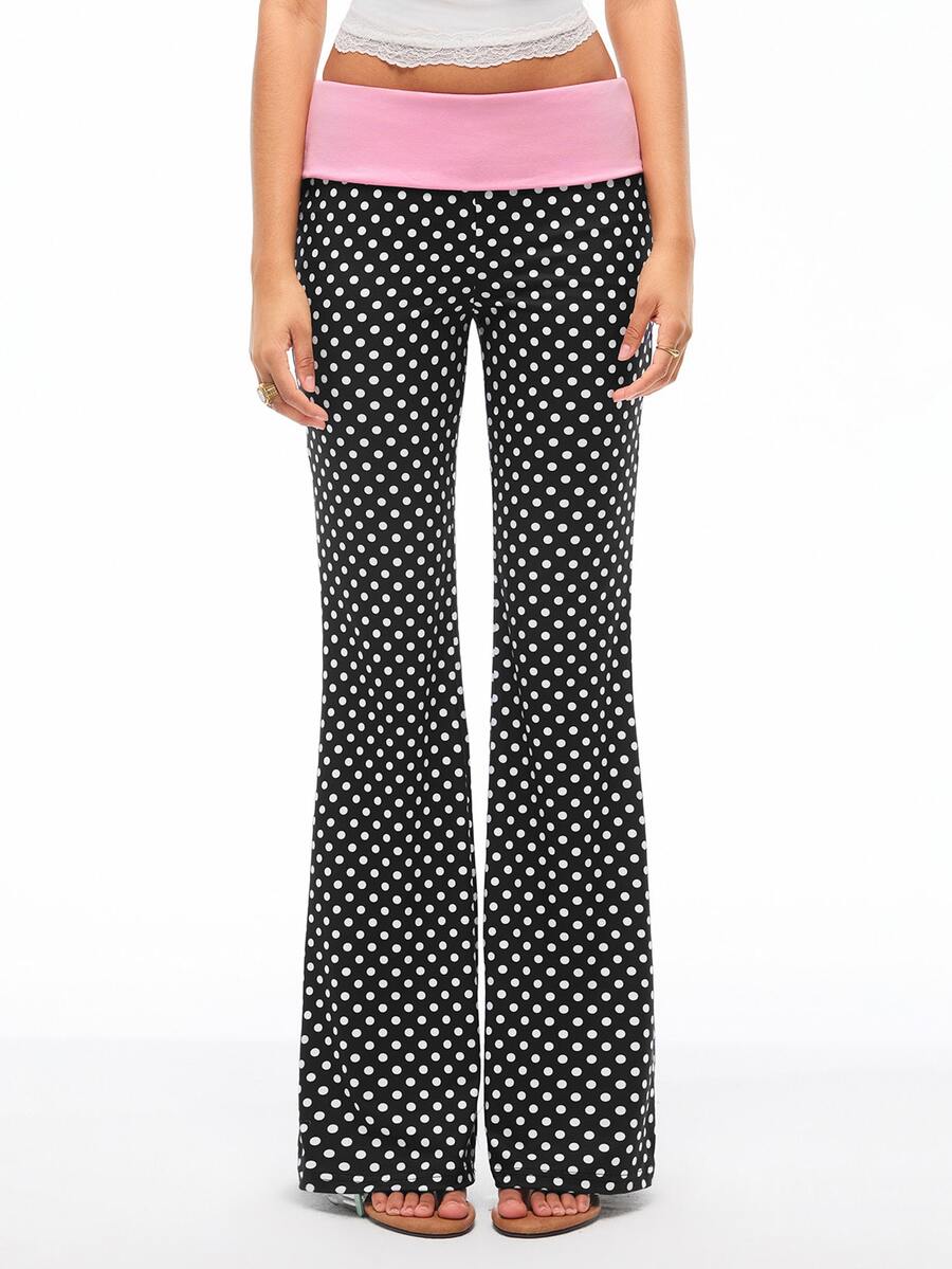 Women's black and white polka dot flare leg pants with side drawstring and ruched details