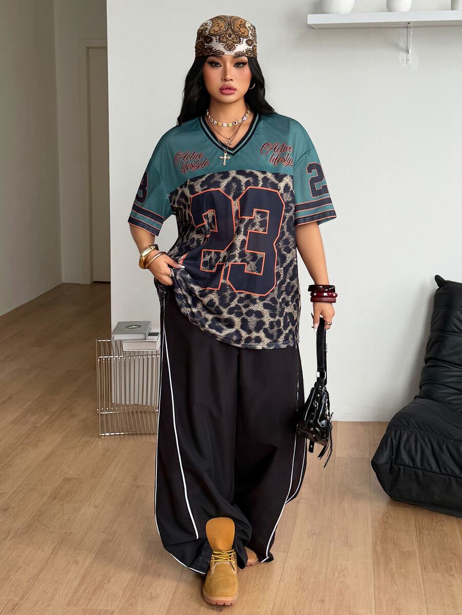Navy blue plus size mesh baseball jersey t-shirt featuring a V-neck, raglan half sleeves, and sporty letter detailing.
