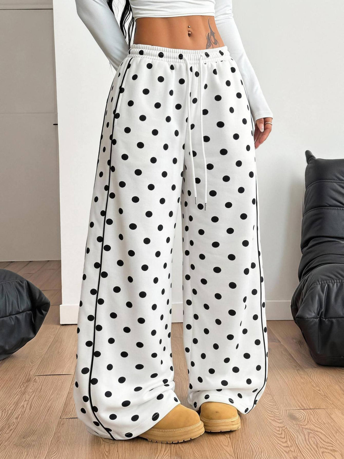 Women's loose fit wide leg graphic sweatpants in light grey with an elastic drawstring waistband